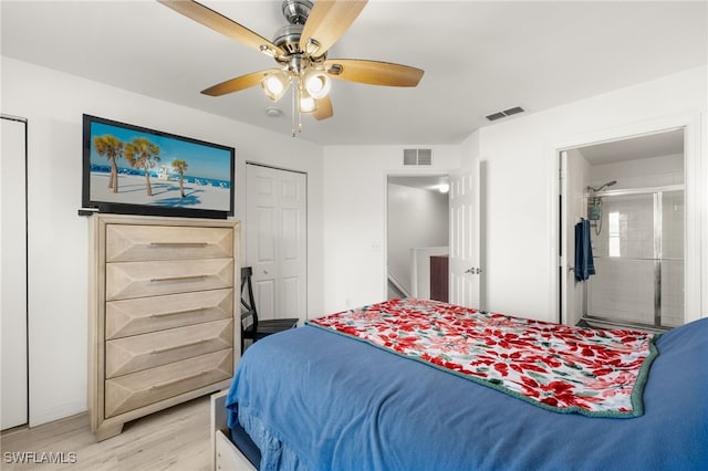 3627 Pine Oak Cir Unit 101, Fort Myers, FL 33916 - bedroom with light wood finished floors, ceiling fan, and ensuite bath