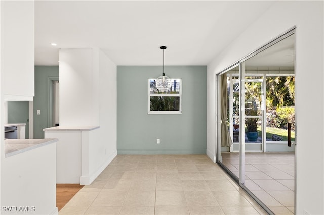 13 Knights Bridge Rd Unit A49, Naples, FL 34112 - unfurnished dining area featuring baseboards, recessed lighting, and light tile patterned floors