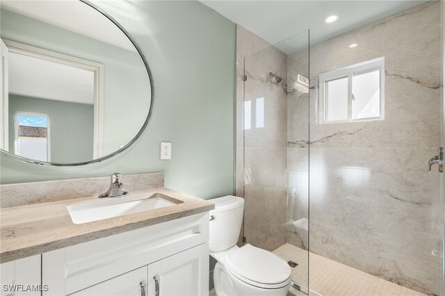 13 Knights Bridge Rd Unit A49, Naples, FL 34112 - bathroom featuring toilet, vanity, and a stall shower
