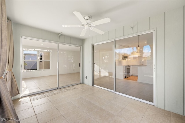 13 Knights Bridge Rd Unit A49, Naples, FL 34112 - unfurnished room with ceiling fan, tile patterned floors, and a sink