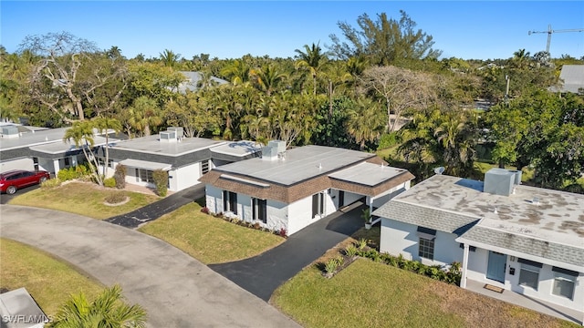 13 Knights Bridge Rd Unit A49, Naples, FL 34112 - view from above of property with a tree filled landscape
