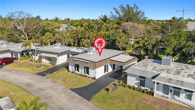 13 Knights Bridge Rd Unit A49, Naples, FL 34112 - view of subject property featuring a tree filled landscape