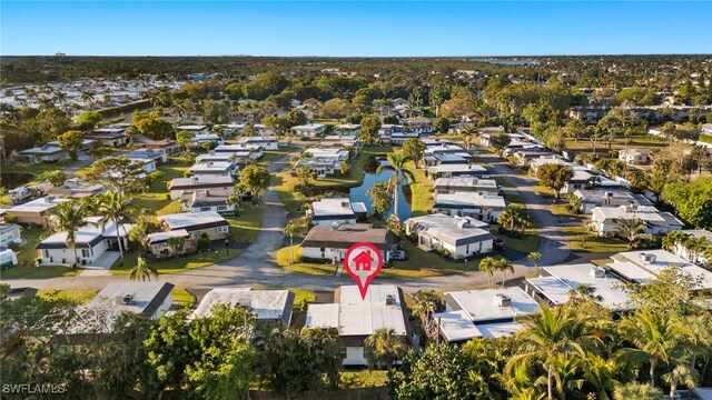 13 Knights Bridge Rd Unit A49, Naples, FL 34112 - aerial view of property and surrounding area featuring nearby suburban area and a large body of water