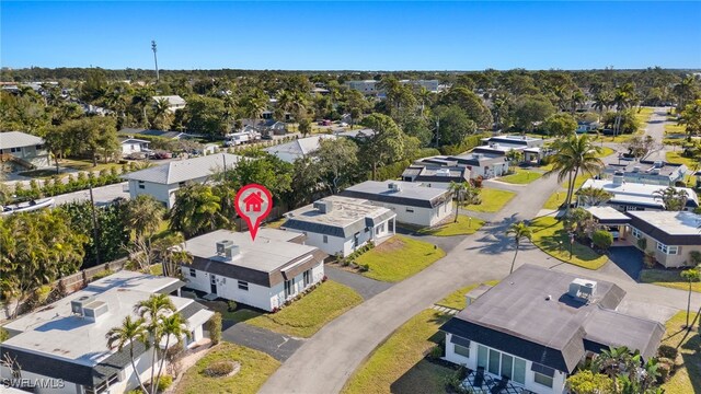 13 Knights Bridge Rd Unit A49, Naples, FL 34112 - aerial perspective of suburban area with a tree filled landscape