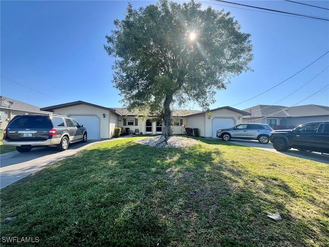 single story home with an attached garage, concrete driveway, and a front yard