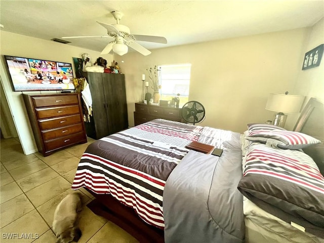 bedroom with light tile patterned flooring and ceiling fan
