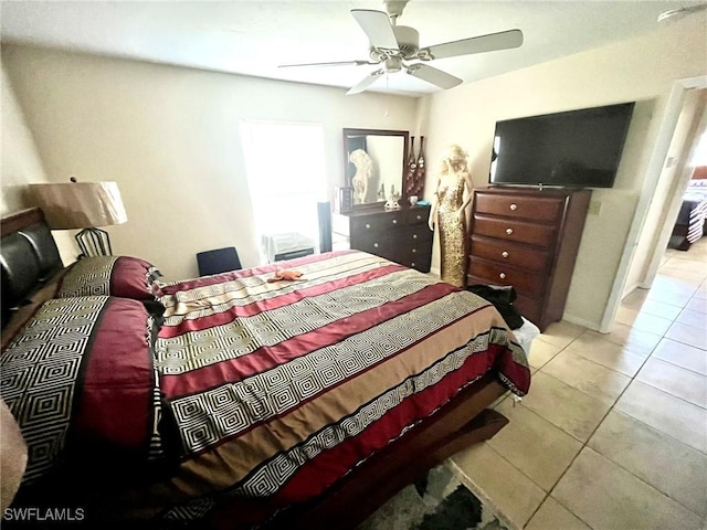 bedroom with tile patterned floors and ceiling fan