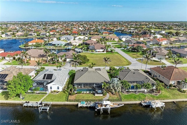 aerial view featuring a residential view and a water view
