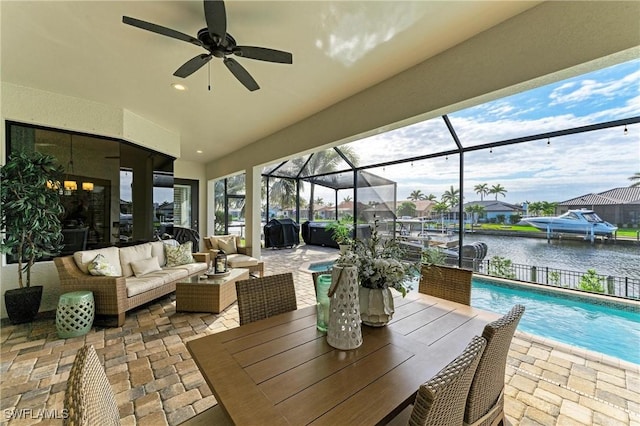 view of patio / terrace featuring glass enclosure, grilling area, outdoor lounge area, an outdoor pool, and ceiling fan