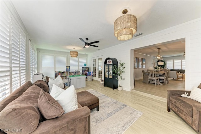 621 Trabue Ave, Punta Gorda, FL 33950 - living room featuring baseboards, light wood-style floors, ceiling fan, and visible vents