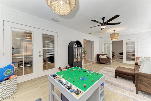 621 Trabue Ave, Punta Gorda, FL 33950 - playroom with french doors, a ceiling fan, light wood-style flooring, and visible vents