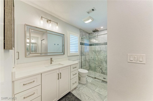 621 Trabue Ave, Punta Gorda, FL 33950 - bathroom with visible vents, a shower stall, marble finish floor, toilet, and vanity