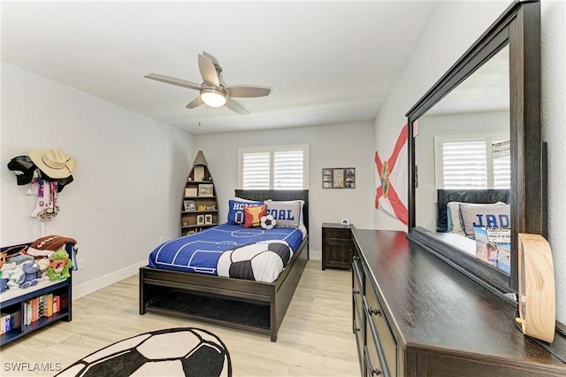 621 Trabue Ave, Punta Gorda, FL 33950 - bedroom with a ceiling fan, baseboards, multiple windows, and light wood finished floors
