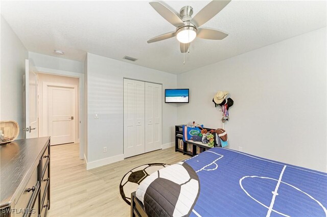 621 Trabue Ave, Punta Gorda, FL 33950 - bedroom with a closet, light wood-style flooring, visible vents, baseboards, and ceiling fan