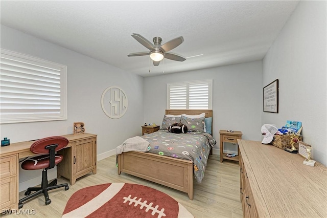 621 Trabue Ave, Punta Gorda, FL 33950 - bedroom featuring baseboards, light wood finished floors, and ceiling fan