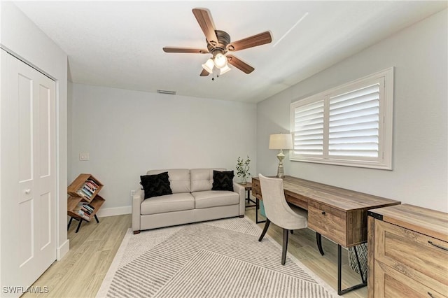 621 Trabue Ave, Punta Gorda, FL 33950 - home office featuring a ceiling fan, baseboards, light wood finished floors, and visible vents