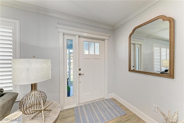 621 Trabue Ave, Punta Gorda, FL 33950 - entryway featuring baseboards, light wood-style flooring, and ornamental molding