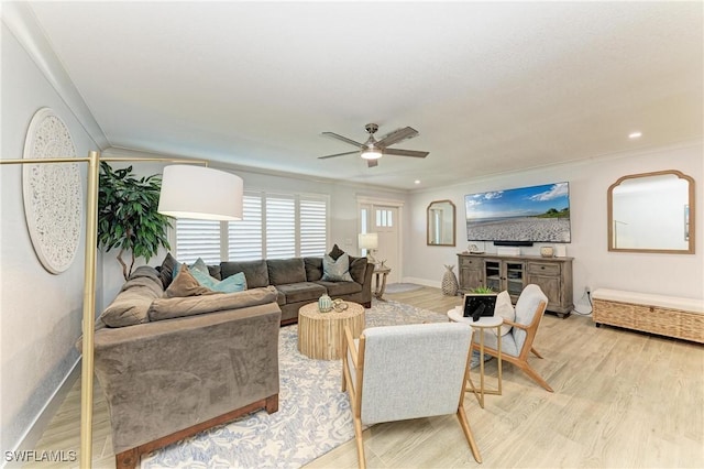 621 Trabue Ave, Punta Gorda, FL 33950 - living area featuring light wood-style flooring, ornamental molding, baseboards, and ceiling fan