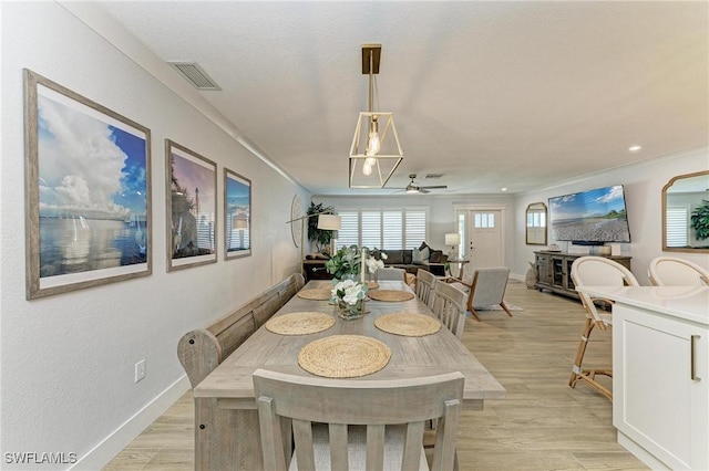 621 Trabue Ave, Punta Gorda, FL 33950 - dining area with light wood-type flooring, baseboards, ceiling fan, and visible vents
