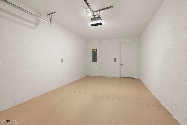 garage featuring electric panel and a garage door opener