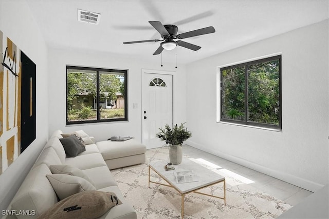 3652 Hibiscus Ave, Naples, FL 34104 - living area featuring a ceiling fan, baseboards, and visible vents