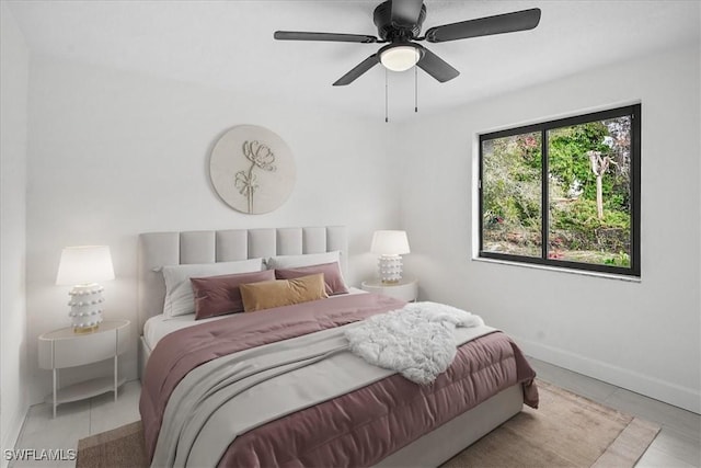 3652 Hibiscus Ave, Naples, FL 34104 - bedroom with tile patterned floors, baseboards, and ceiling fan