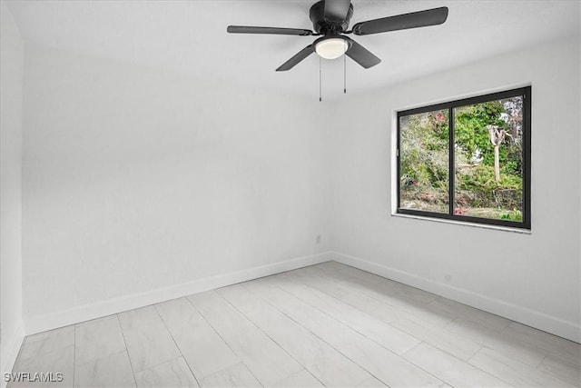 3652 Hibiscus Ave, Naples, FL 34104 - spare room with ceiling fan and baseboards