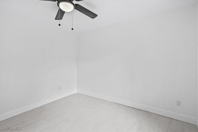 3652 Hibiscus Ave, Naples, FL 34104 - unfurnished room with baseboards and a ceiling fan