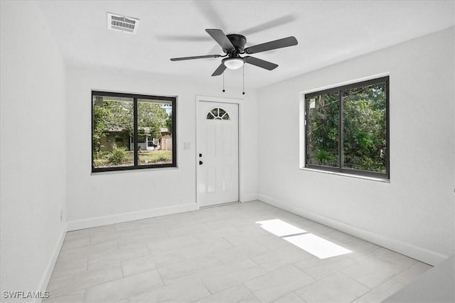 3652 Hibiscus Ave, Naples, FL 34104 - empty room with baseboards, visible vents, and ceiling fan