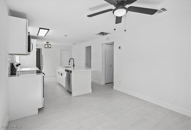3652 Hibiscus Ave, Naples, FL 34104 - kitchen with a sink, ceiling fan, light countertops, stainless steel appliances, and white cabinetry