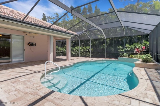 24840 Divot Dr, Bonita Springs, FL 34135 - outdoor pool with a patio area and glass enclosure