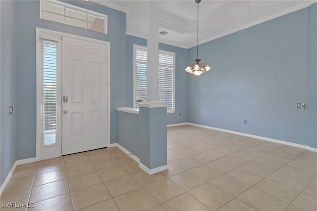 24840 Divot Dr, Bonita Springs, FL 34135 - entrance foyer featuring crown molding, light tile patterned flooring, a chandelier, ornate columns, and baseboards