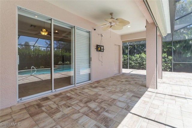 24840 Divot Dr, Bonita Springs, FL 34135 - view of patio / terrace with ceiling fan and a lanai