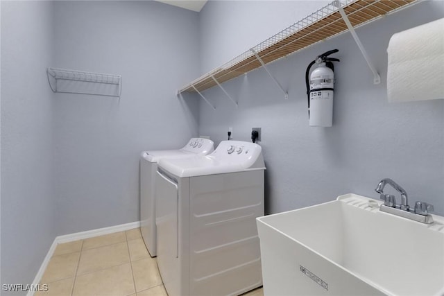 24840 Divot Dr, Bonita Springs, FL 34135 - laundry area featuring washer and dryer, baseboards, and light tile patterned flooring