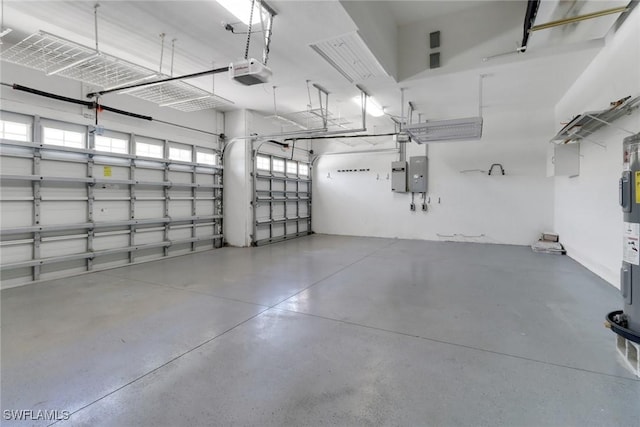 24840 Divot Dr, Bonita Springs, FL 34135 - garage featuring a garage door opener and electric panel