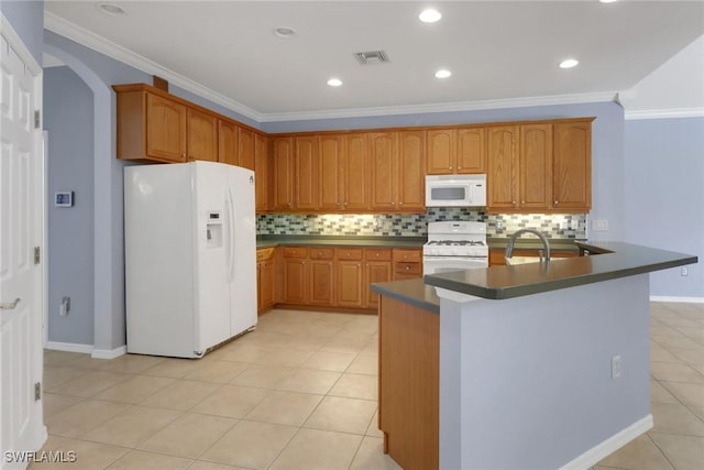 24840 Divot Dr, Bonita Springs, FL 34135 - kitchen with white appliances, tasteful backsplash, dark countertops, crown molding, and light tile patterned floors