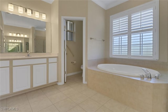 24840 Divot Dr, Bonita Springs, FL 34135 - bathroom featuring a garden tub, toilet, vanity, tile patterned flooring, and baseboards