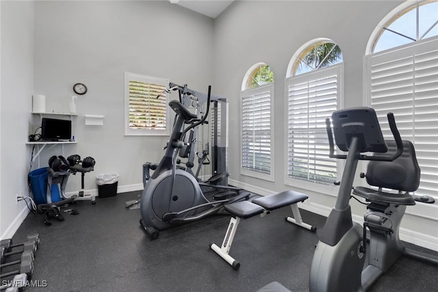 24840 Divot Dr, Bonita Springs, FL 34135 - exercise area with baseboards and a high ceiling