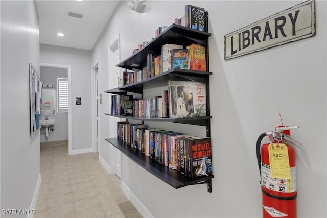 24840 Divot Dr, Bonita Springs, FL 34135 - hall featuring tile patterned floors, baseboards, and recessed lighting