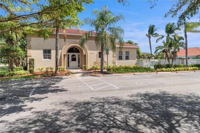 24840 Divot Dr, Bonita Springs, FL 34135 - view of property featuring uncovered parking