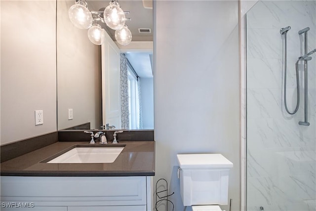 full bathroom with toilet, visible vents, vanity, and a marble finish shower