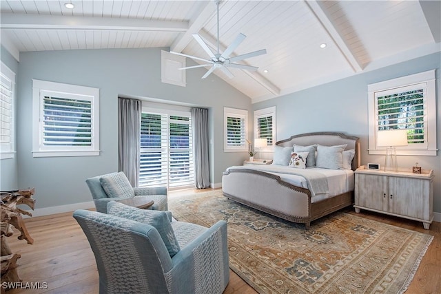 bedroom featuring vaulted ceiling with beams, a ceiling fan, baseboards, wood ceiling, and wood finished floors