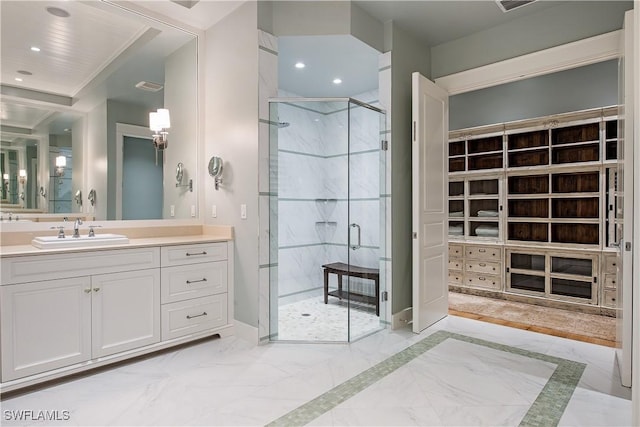 bathroom with recessed lighting, a stall shower, marble finish floor, and vanity