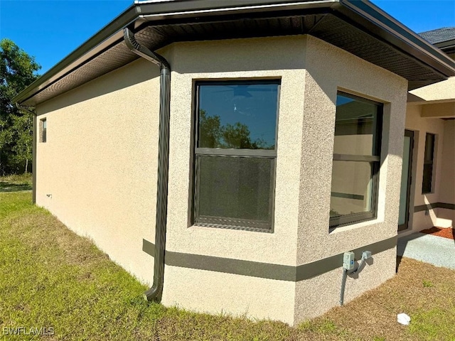 view of home's exterior with stucco siding