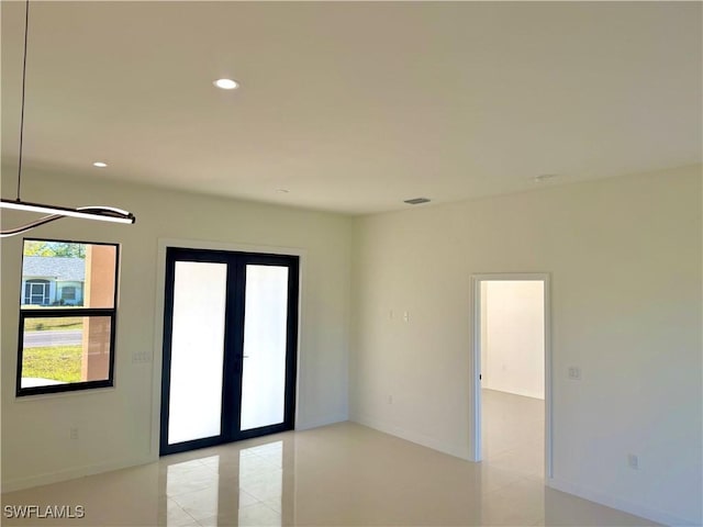 unfurnished room featuring light tile patterned flooring, recessed lighting, visible vents, and baseboards