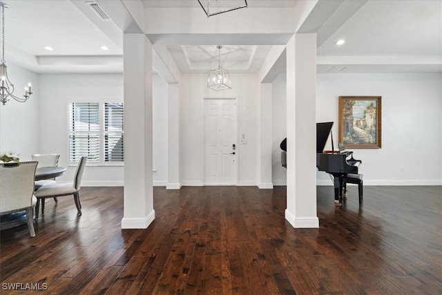 5135 Genoa St, Ave Maria, FL 34142 - entryway with a notable chandelier, a tray ceiling, and wood-type flooring