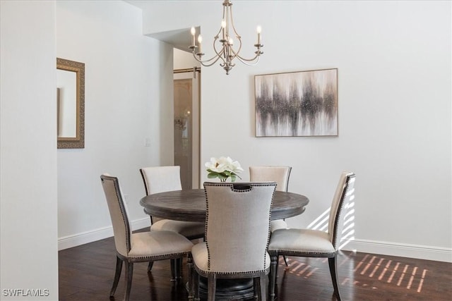 5135 Genoa St, Ave Maria, FL 34142 - dining area featuring baseboards, an inviting chandelier, and dark wood-style flooring