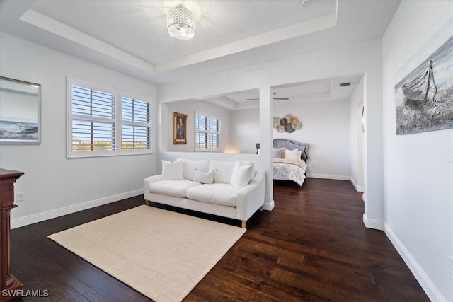 5135 Genoa St, Ave Maria, FL 34142 - bedroom featuring visible vents, a raised ceiling, baseboards, and wood-type flooring