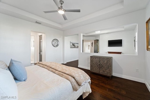 5135 Genoa St, Ave Maria, FL 34142 - bedroom with a ceiling fan, baseboards, visible vents, a tray ceiling, and hardwood / wood-style flooring