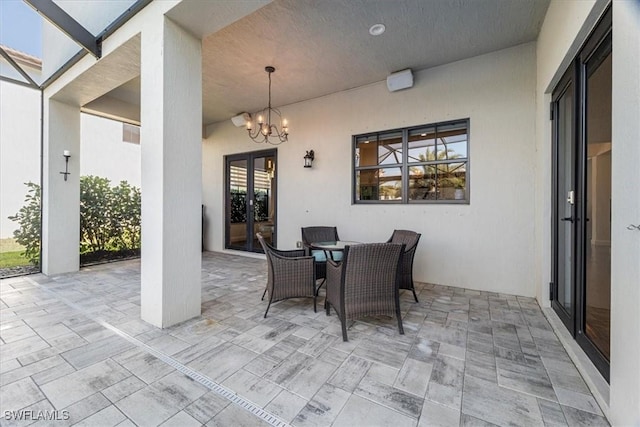 5135 Genoa St, Ave Maria, FL 34142 - view of patio / terrace with french doors and glass enclosure